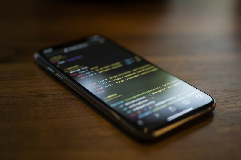 Software engineer developing and testing cross-platform mobile applications