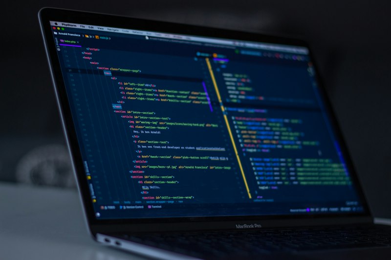 Professional software developer writing code in modern development environment